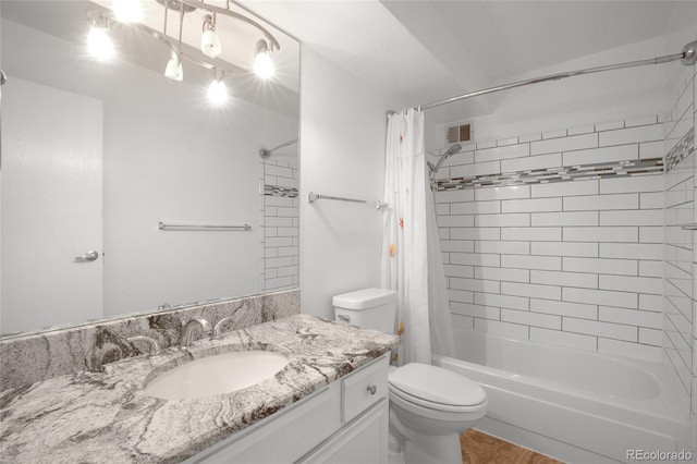 full bathroom featuring vanity, toilet, and shower / bath combination with curtain