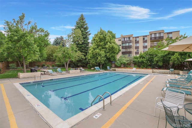 view of swimming pool with a patio