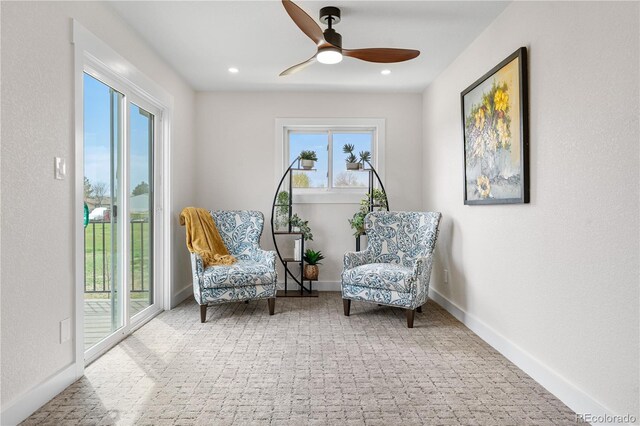 sitting room with a ceiling fan, carpet, recessed lighting, and baseboards
