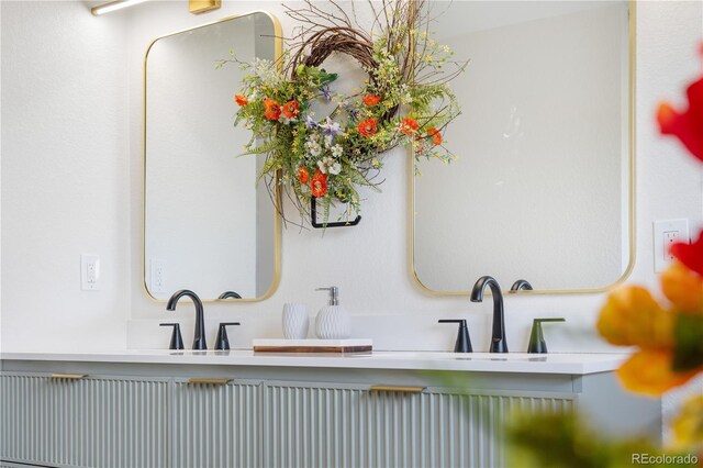 bathroom featuring double vanity