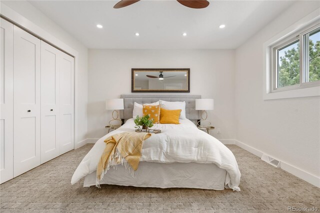 carpeted bedroom with recessed lighting, baseboards, a ceiling fan, and a closet