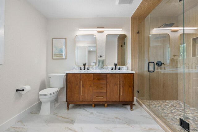 full bathroom featuring baseboards, toilet, a stall shower, double vanity, and marble finish flooring