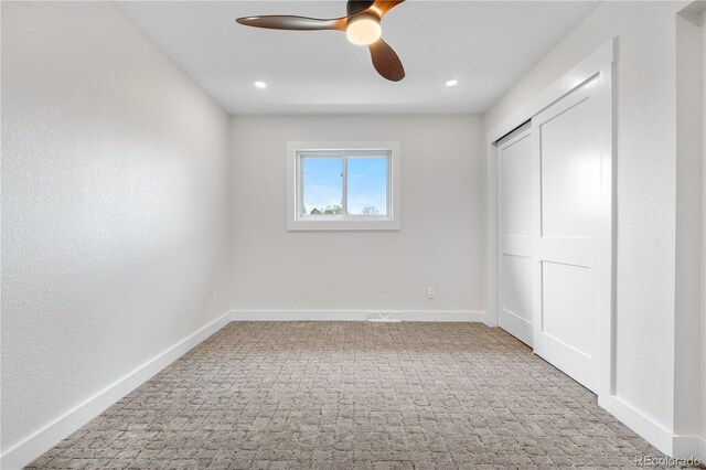 unfurnished bedroom with carpet flooring, recessed lighting, a ceiling fan, and baseboards