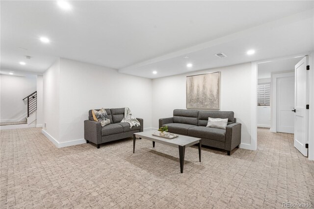 living area with light carpet, recessed lighting, stairway, and baseboards