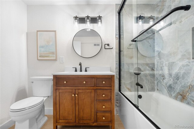 full bath featuring toilet, enclosed tub / shower combo, vanity, and baseboards