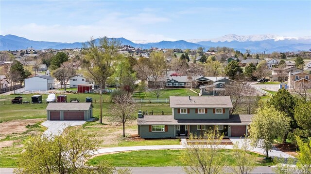aerial view of residential area featuring a mountain backdrop