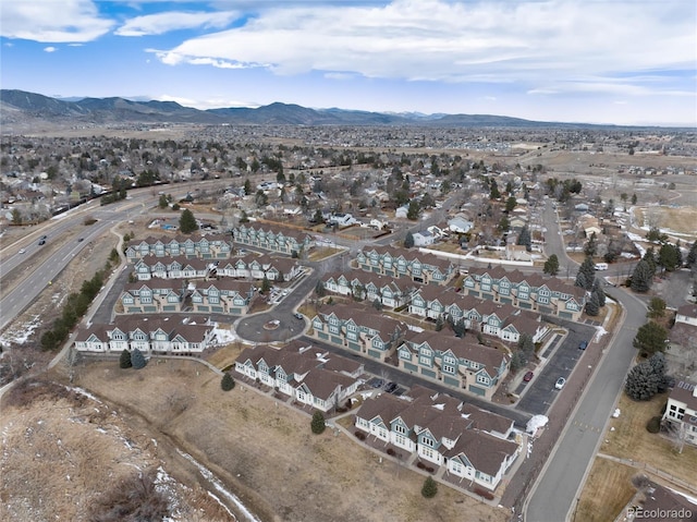 birds eye view of property featuring a mountain view