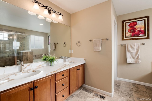 bathroom with vanity and an enclosed shower