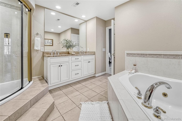 bathroom with shower with separate bathtub, vanity, and tile patterned floors