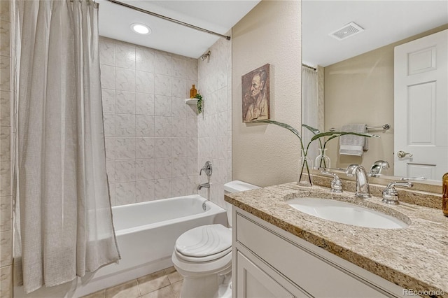 full bathroom with tile patterned flooring, vanity, toilet, and shower / tub combo