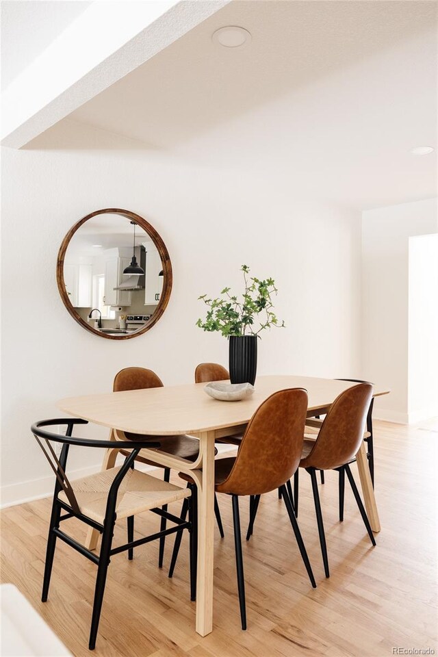 2263 Yellowstone St, Golden, CO 80401 - dining space with light wood finished floors and baseboards