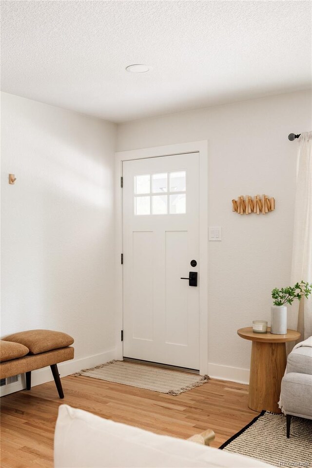 2263 Yellowstone St, Golden, CO 80401 - foyer entrance featuring light wood-type flooring and baseboards