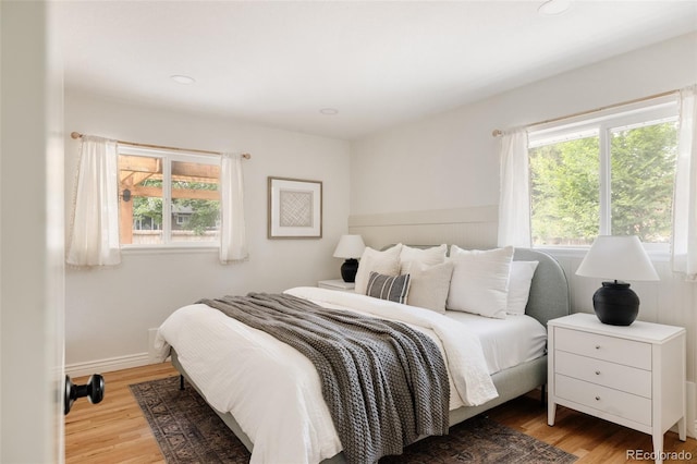 2263 Yellowstone St, Golden, CO 80401 - bedroom with multiple windows, wood finished floors, and recessed lighting