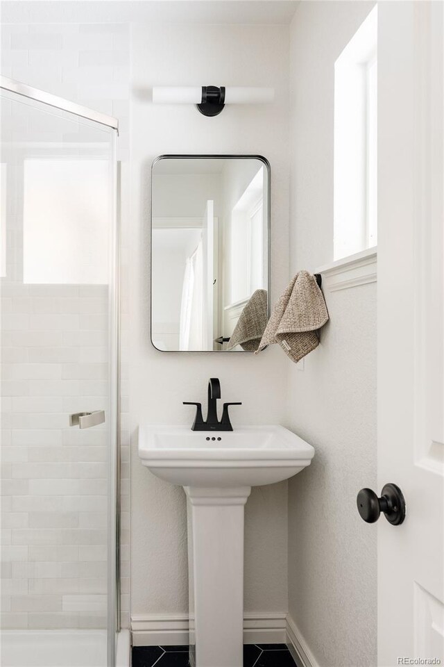 2263 Yellowstone St, Golden, CO 80401 - full bathroom featuring a shower stall and baseboards