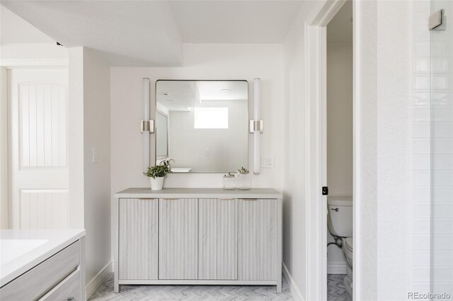 2263 Yellowstone St, Golden, CO 80401 - full bathroom featuring vanity and baseboards