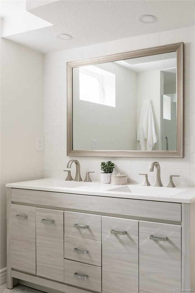 2263 Yellowstone St, Golden, CO 80401 - full bath with double vanity and backsplash