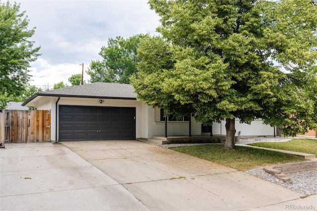 2263 Yellowstone St, Golden, CO 80401 - view of front facade featuring an attached garage, driveway, and stucco siding