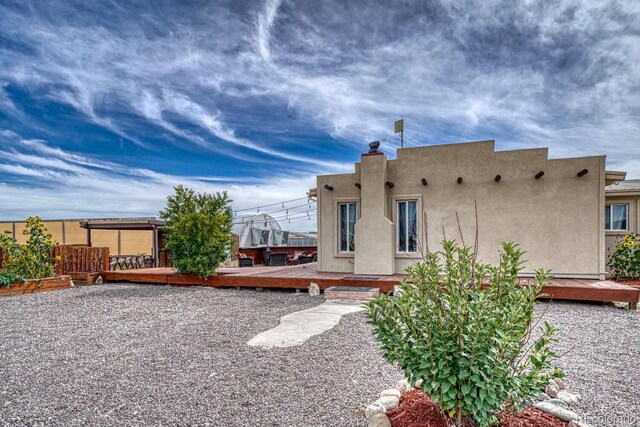 56506 County Road Aa, Moffat, CO 81143 - rear view of property with a deck and stucco siding