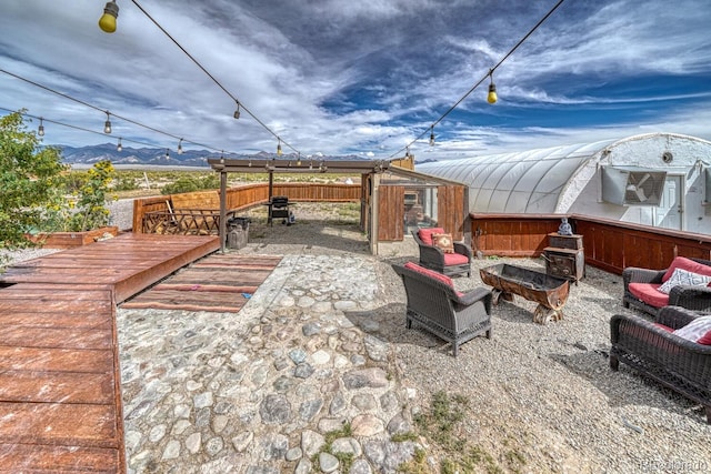 56506 County Road Aa, Moffat, CO 81143 - view of patio with fence and a mountain view