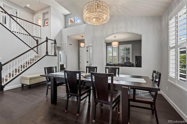 dining space with dark hardwood / wood-style flooring