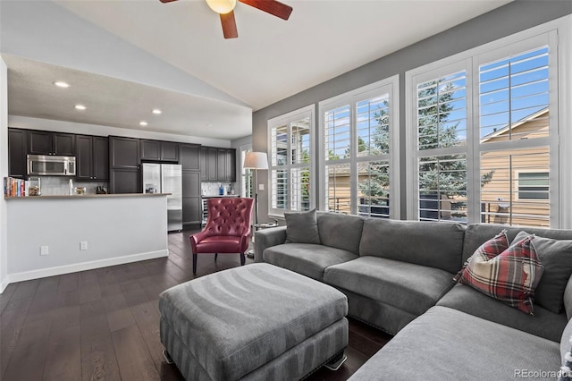 living room with ceiling fan, dark wood-type flooring, and lofted ceiling