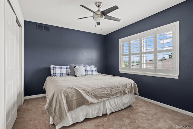 bedroom with carpet, a closet, and ceiling fan