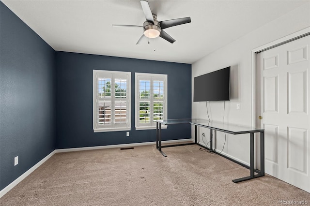 interior space featuring carpet and ceiling fan