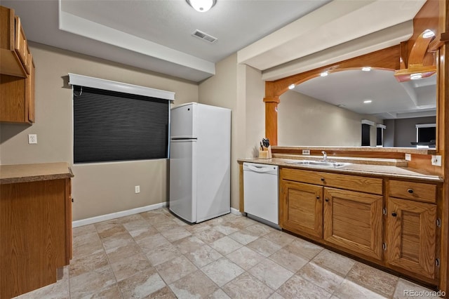 kitchen with white appliances and sink