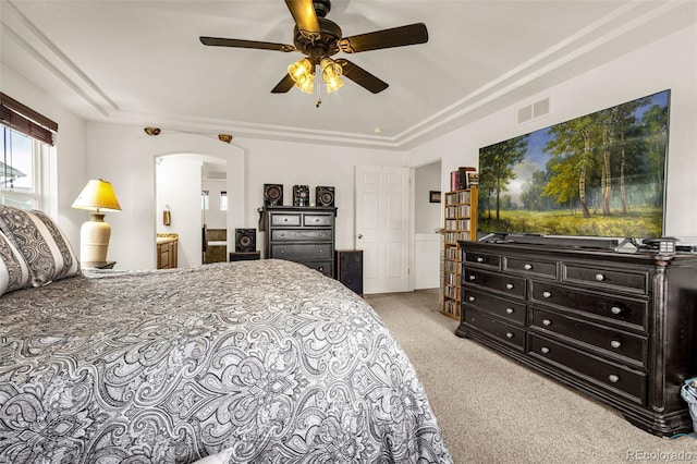 20109 Randolph Pl, Denver, CO 80249 - bedroom featuring light carpet, arched walkways, connected bathroom, and ceiling fan