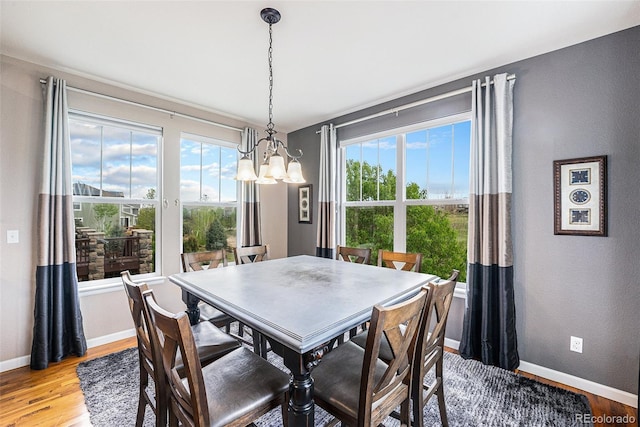 2349 Hickory Pl, Erie, CO 80516 - dining room featuring baseboards, a chandelier, and light wood-type flooring