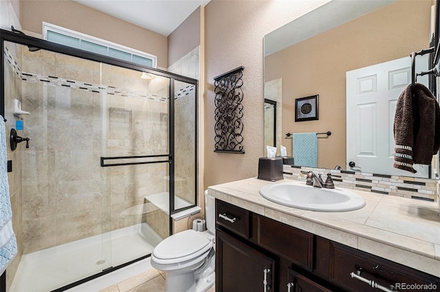 2349 Hickory Pl, Erie, CO 80516 - full bath featuring toilet, tile patterned floors, a shower stall, and vanity