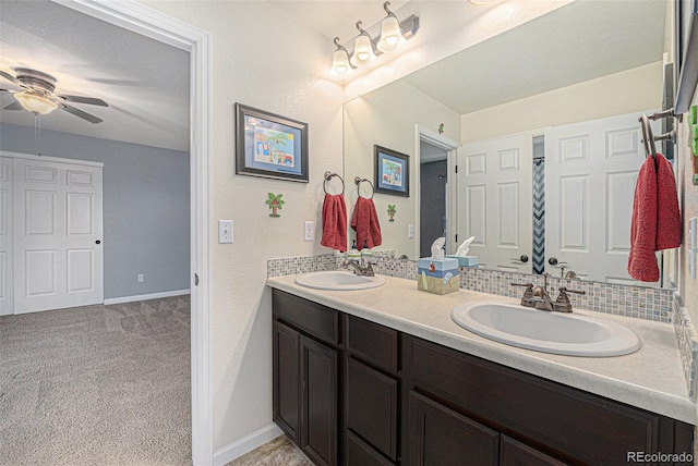 2349 Hickory Pl, Erie, CO 80516 - bathroom featuring a sink, baseboards, a ceiling fan, and double vanity