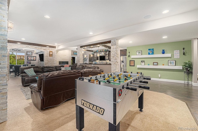 2349 Hickory Pl, Erie, CO 80516 - playroom with recessed lighting, arched walkways, decorative columns, and wood finished floors