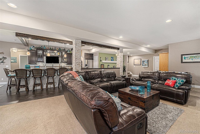 2349 Hickory Pl, Erie, CO 80516 - living room featuring carpet floors, decorative columns, and baseboards