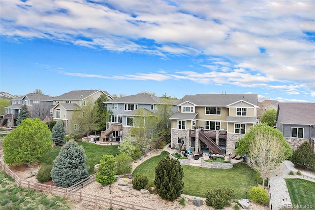 2349 Hickory Pl, Erie, CO 80516 - back of house with a residential view, a wooden deck, a patio, stairs, and stone siding