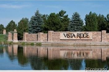 2349 Hickory Pl, Erie, CO 80516 - community / neighborhood sign featuring a water view