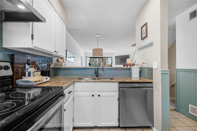 8773 W Cornell Ave Unit 10, Lakewood, CO 80227 - kitchen with stainless steel electric range oven, dishwasher, under cabinet range hood, a sink, and white cabinets