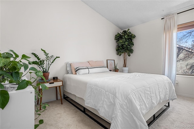 8773 W Cornell Ave Unit 10, Lakewood, CO 80227 - carpeted bedroom with lofted ceiling and baseboards