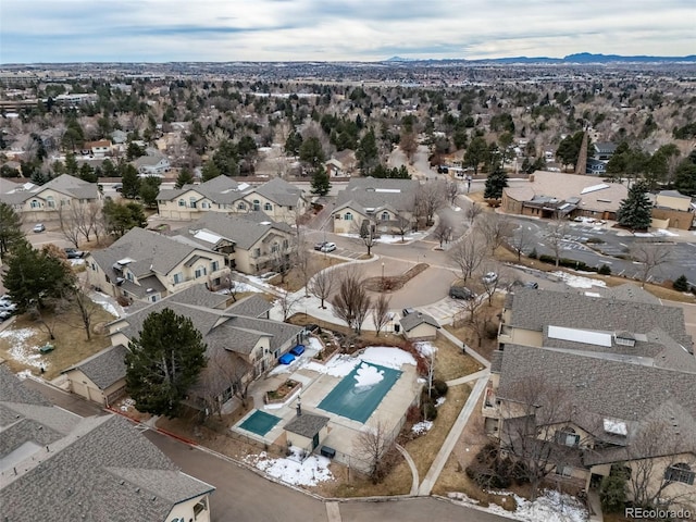 aerial view of property's location featuring nearby suburban area and a pool