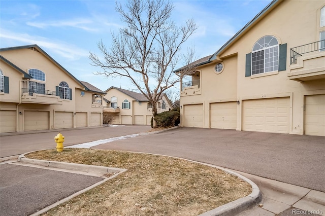 8621 E Dry Creek Rd Unit 325, Englewood, CO 80112 - view of asphalt road featuring a residential view