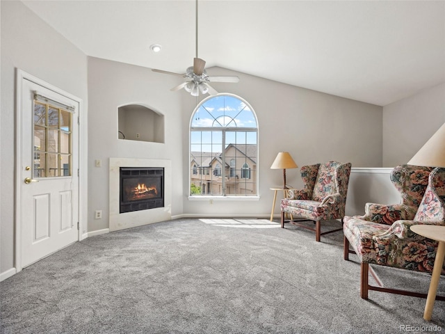 8621 E Dry Creek Rd Unit 325, Englewood, CO 80112 - living area with a warm lit fireplace, carpet floors, a ceiling fan, lofted ceiling, and baseboards