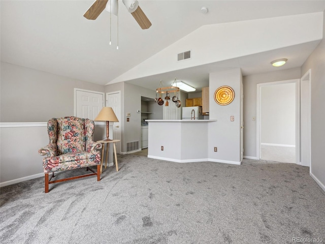 8621 E Dry Creek Rd Unit 325, Englewood, CO 80112 - living area with lofted ceiling, carpet flooring, a ceiling fan, and baseboards