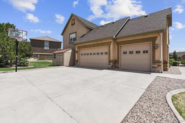 view of home's exterior with stucco siding, stone siding, concrete driveway, and a shingled roof