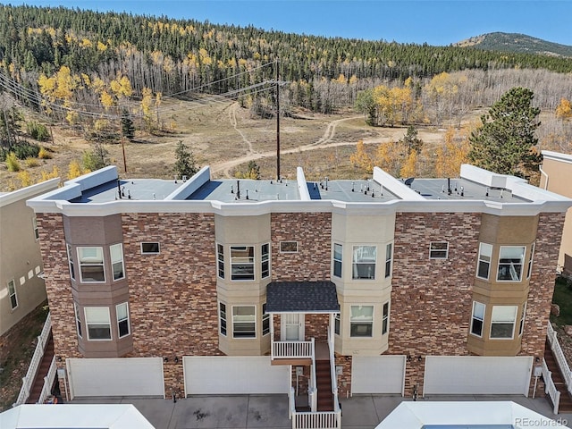 birds eye view of property featuring a mountain view