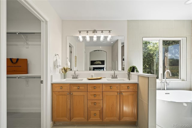 1511 Peninsula Cir, Castle Rock, CO 80104 - full bathroom featuring double vanity, a freestanding bath, and a walk in closet