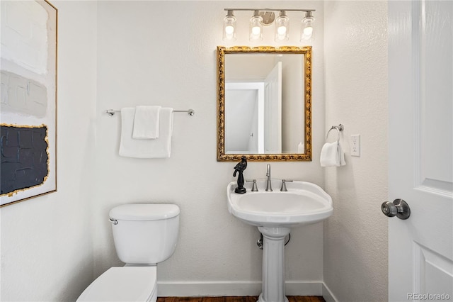 1511 Peninsula Cir, Castle Rock, CO 80104 - half bath featuring toilet and wood finished floors