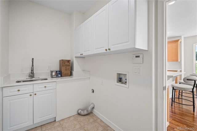 1511 Peninsula Cir, Castle Rock, CO 80104 - laundry area with cabinet space, hookup for a washing machine, and light tile patterned flooring
