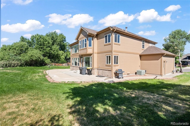 1511 Peninsula Cir, Castle Rock, CO 80104 - back of property featuring a patio area and a lawn