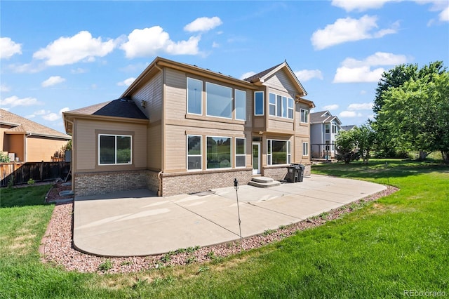 1511 Peninsula Cir, Castle Rock, CO 80104 - back of house featuring a patio area and brick siding