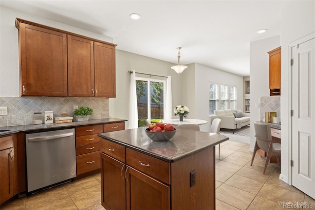 kitchen with dishwasher, a center island, pendant lighting, decorative backsplash, and light tile patterned flooring